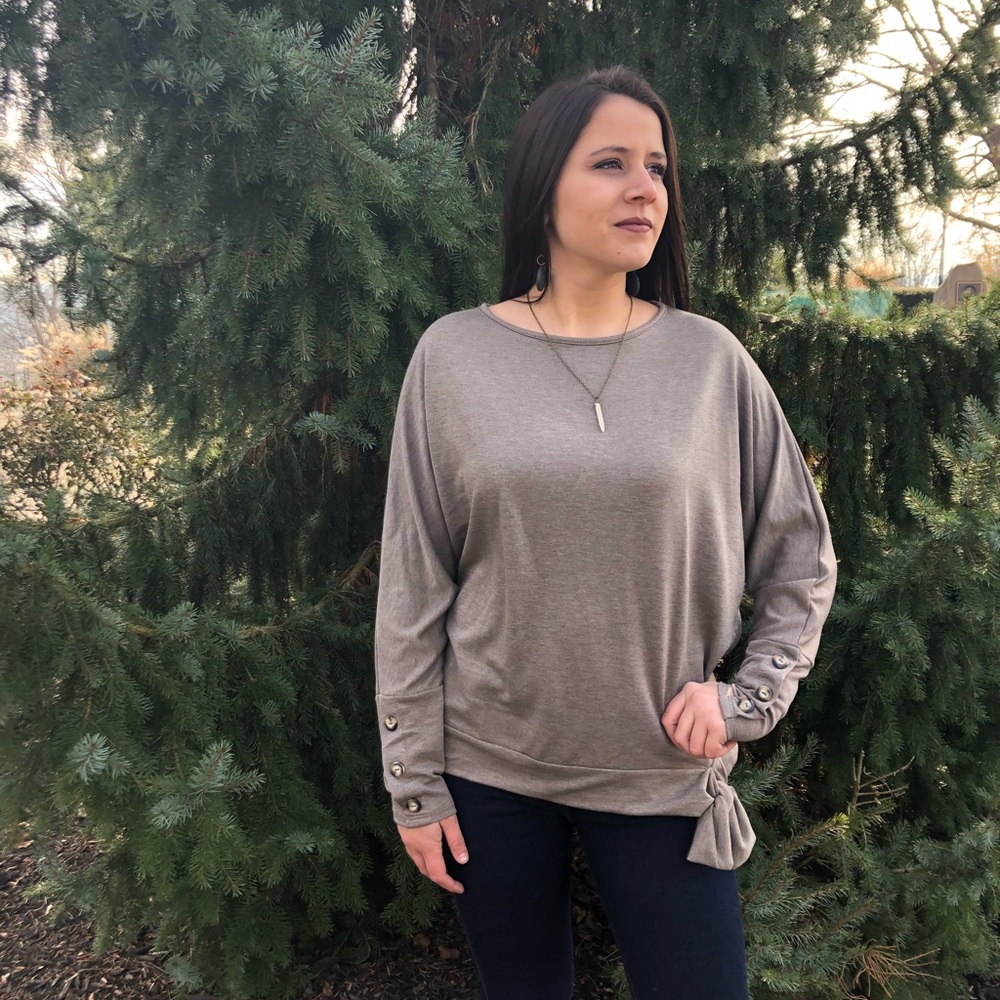 Sweater with buttons on sleeves